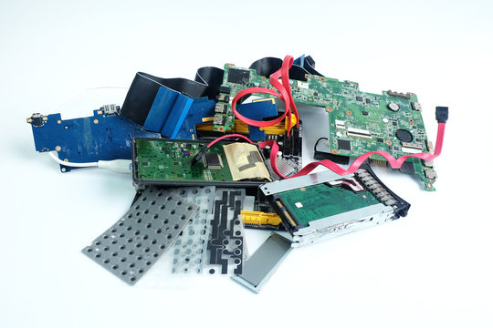 Pile of electronic waste isolated on white