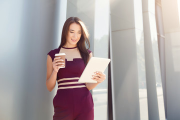 Portrait of a confident young businesswoman with digital tablet