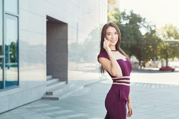 Portrait of a confident young businesswoman talking on cell