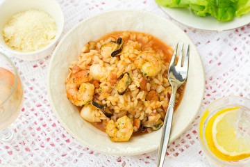 Italian rice dish risotto with seafood, shrimps and mussels