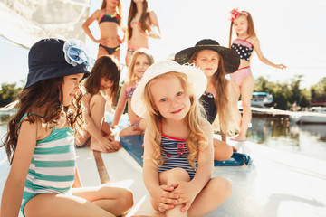 The children on board of sea yacht
