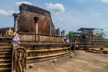 POLONNARUWA, SRI LANKA - JULY 22, 2016: Local school children visit Vatadage in the ancent city Polonnaruwa, Sri Lanka