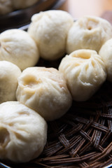 Xiaolongbao, dim sum in bamboo steamer. Dumplings in bamboo steamer