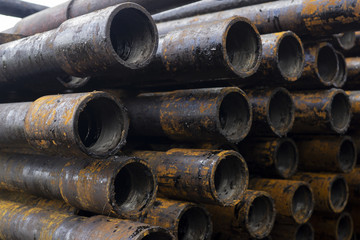 Oil Drill pipe. Rusty drill pipes were drilled in the well section. Downhole drilling rig. Laying...