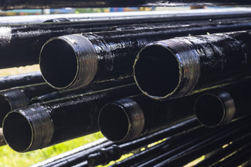 Oil Drill pipe. Rusty drill pipes were drilled in the well section. Downhole drilling rig. Laying...
