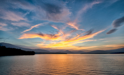 Dramatic Sunset with Blue Sky at the Ashokan Reservoir in Ulster County in New York. Golden light...