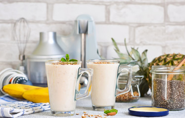 Obraz na płótnie Canvas Smoothies with yoghurt, pineapple and banana for breakfast. A natural diet drink. Detox menu.
