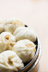 Xiaolongbao, dim sum in bamboo steamer. Dumplings in bamboo steamer