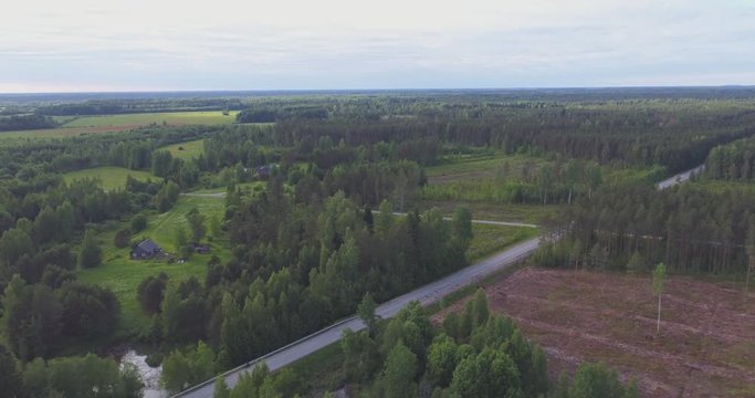 Aerial footage of low altitude flight iver the river. Green trees, summer nature landscape.