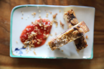 Dessert Blueberry cheese cake with strawberry jam on wood table background