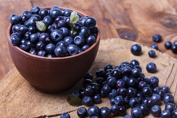 in a bowl a lot of blueberry blueberry on a dark background