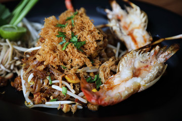 Shrimp pad thai noodles with shrimps on top , Thai food
