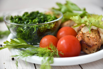 Chicken with tomatoes, parsley and dill.