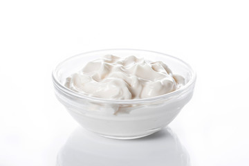 Sour cream in crystal bowl isolated on white background

