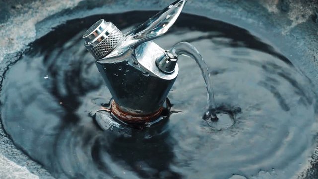 A close-up of a drinking fountain. Fountain of drinking water in the city park