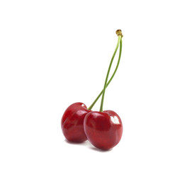 two related ripe large red cherries