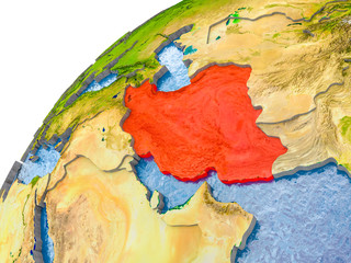 Map of Iran in red on globe