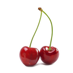 two related ripe big red cherries close