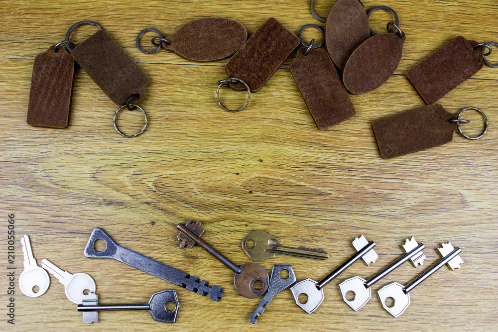 Poster different vintage keys on a table. empty space for your text and design.