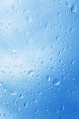 Bright drops water on glass. It's raining. Texture, background, pattern. design for screensaver.