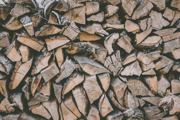 Firewood for the winter, stacks of firewood. Wooden background