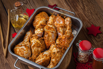 Marinated chicken drumsticks ready for baking.