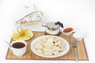 Vareniki with cottage cheese for tea. A perfect addition to the vareniki will be sour cream and a cool sweet jam.