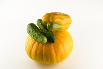 yellow pumpkin with pepper and cucumber