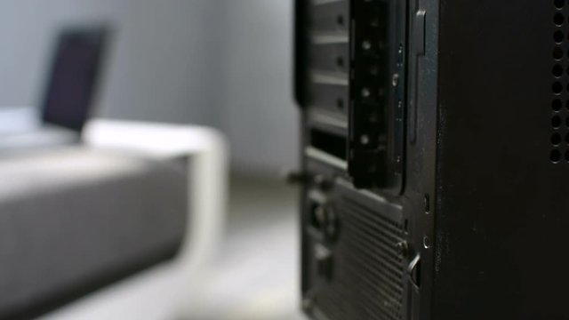 PC personal computer maintenance by master removing case loosening screw closeup