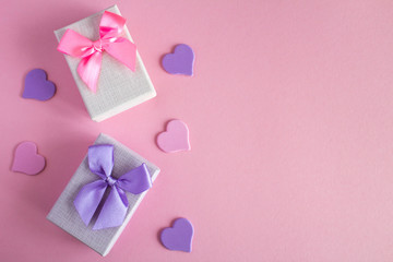 Two gifts  with colorful ribbon on the pink background.Top view.Copy space.