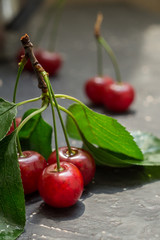 Ripe cherry on a dark table