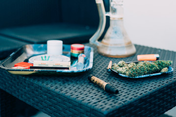 Marijuana plant with smoking devices