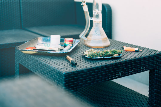 Marijuana plant with smoking devices