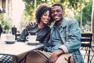 Young happy black couple outdoors - Powered by Adobe