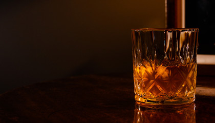 Whiskey on the rocks in a crystal tumbler