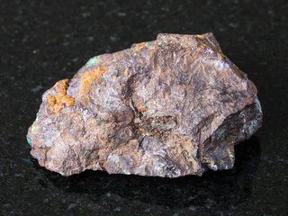 Cuprite and Malachite in Limonite rock on dark