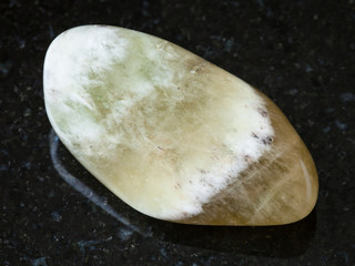 polished Prasiolite gemstone on black