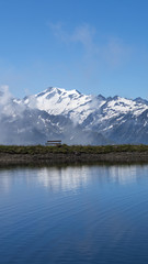 Bench with the view on Austrian mountains