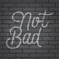 Obraz premium Hand drawn lettering slogan on brick wall background