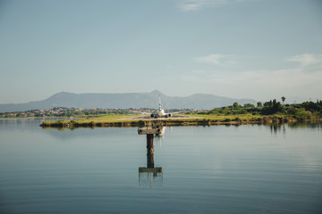 the plane is landing to the airport of Corfu at summer day