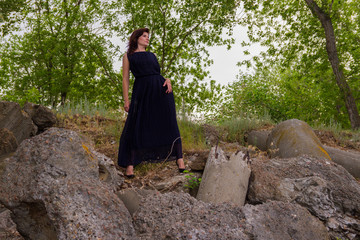 Naklejka premium A girl in a black dress standing