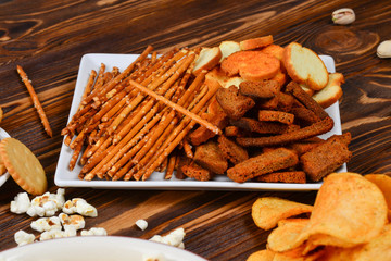 Snacks on a wooden background. Space for text or design.