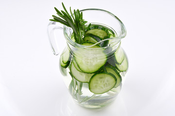 Cucumber and Rosemary Infused Water on wooden table