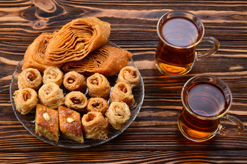 Turkish sweet baklava on plate with Turkish tea.