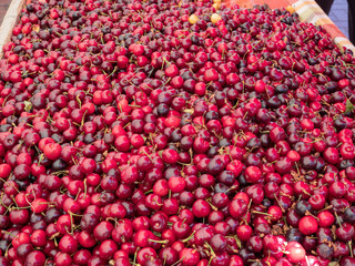 Overhead shot of cherries on table in a marketplace
