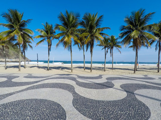 Famous boardwalk of Copacabana beach with  palms trees - Rio de Janeiro Brazil