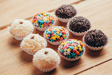 Handmade brazilian sweets: Beijinho and Brigadeiro. Common in children birthday party. Macro, close up