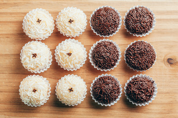 Handmade brazilian sweets: Beijinho and Brigadeiro. Common in children birthday party. Macro, close up