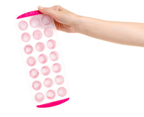 Plastic form for ice in hand on a white background isolation