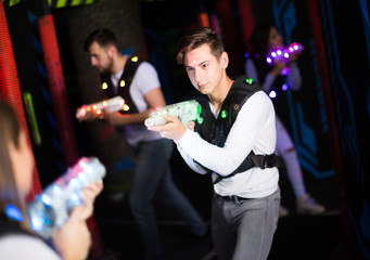 Emotional guy playing laser tag
